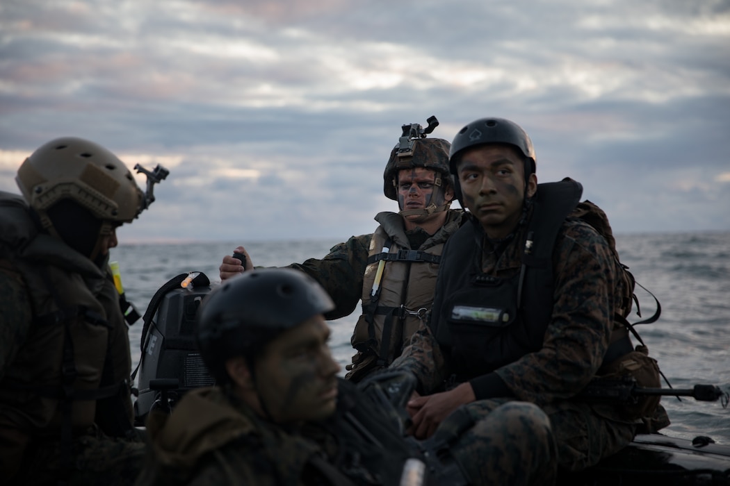 U.S. Marines with Company F, 2nd Battalion, 4th Marine Regiment, 1st Marine Division, prepare to insert scout swimmers during the Expeditionary Operations Training Group evaluation on Marine Corps Base Camp Pendleton, California, March 19, 2020. The Marines of Company F conducted boat raids during both day and night for their culminating exercise in preparation for deployment. (U.S. Marine Corps photo by Lance Cpl. Benjamin Aulick)