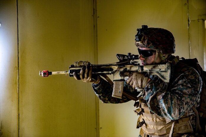 U.S Marine Corps Cpl. Jacob Cimini, a rifleman with Company F, 2nd Battalion, 4th Marine Regiment, 1st Marine Division, sets security during the Expeditionary Operations Training Group evaluation on Marine Corps Base Camp Pendleton, California, March 19, 2020. The Marines of Company F conducted boat raids during both day and night for their culminating exercise in preparation for deployment. (U.S. Marine Corps photo by Lance Cpl. Benjamin Aulick)