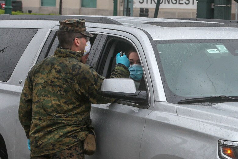 Lance Cpl. Anthony Edwards, a rifleman with Lima Company, 3rd Battalion, 2nd Marines, Task Force New York, screens personnel while providing support to hospital ship USNS Comfort (T-AH 20) during COVID-19 relief efforts in New York, New York, April 18, 2020. Comfort cares for trauma, emergency and urgent care patients without regard to their COVID-19 status. Comfort is working with the Javits New York Medical Station as an integrated system to relieve the New York City medical system, in support of U.S. Northern Command’s Defense Support of Civil Authorities as a response to the COVID-19 pandemic. (U.S. Marine Corps photo by Sgt. Stormy Mendez)