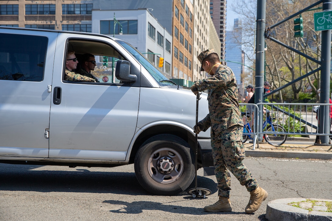 Lance Cpl. Randoll Gonzales, a rifleman with Lima Company, 3rd Battalion, 2nd Marines, Task Force New York, screens vehicles while providing security for the USNS Comfort (T-AH 20) during COVID-19 relief efforts in New York City, April 19, 2020. Comfort cares for trauma, emergency and urgent care patients without regard to their COVID-19 status. Comfort is working with the Javits New York Medical Station as an integrated system to relieve the New York City medical system, in support of U.S. Northern Command's Defense Support of Civil Authorities as a response to the COVID-19 pandemic. (U.S. Marine Corps photo by Sgt. Stormy Mendez)