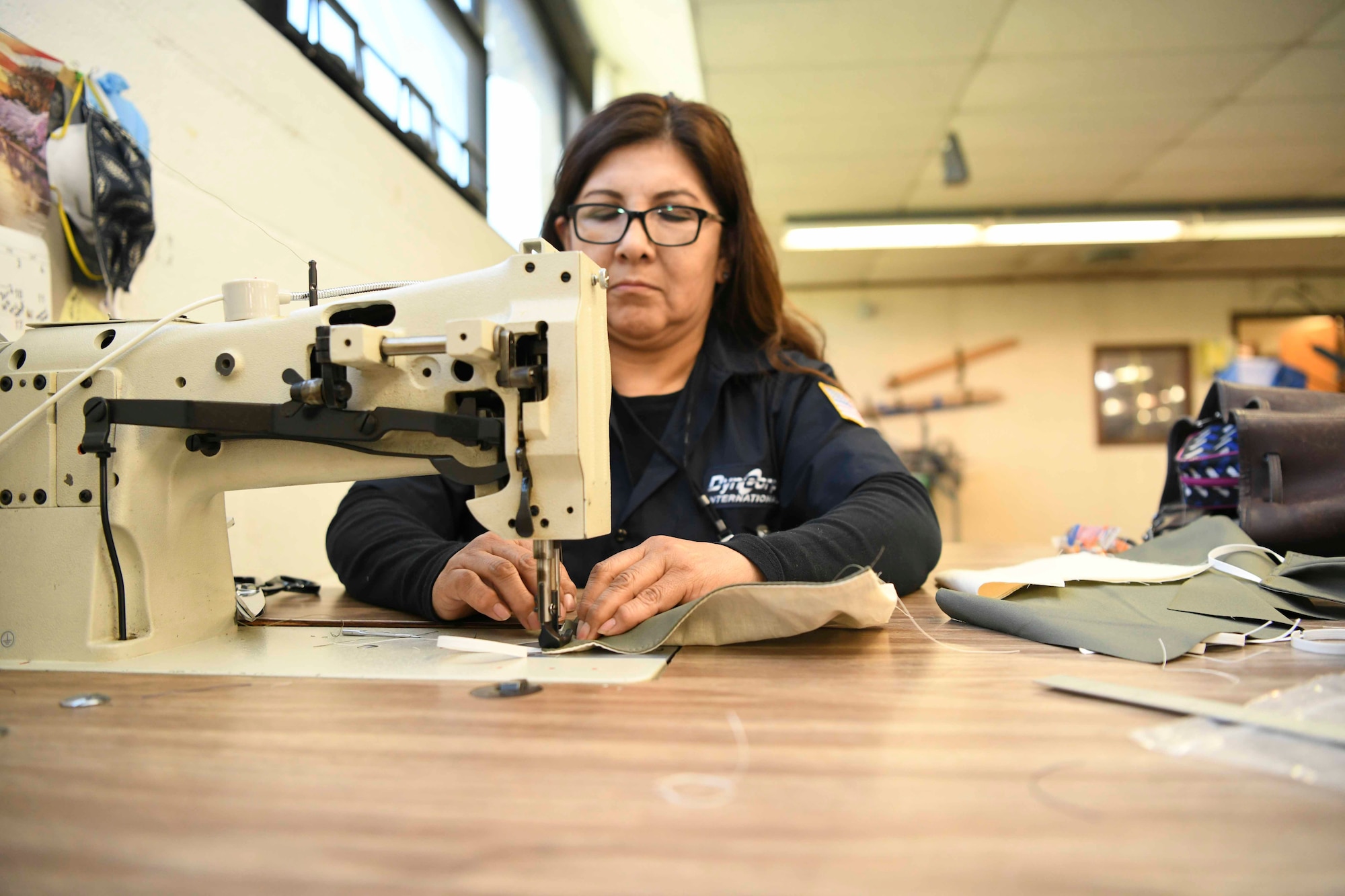 Wilma Zeballos, 89th Maintenance Group survival shop seamstress, sews a facemask at Joint Base Andrews, Md., Apr. 16, 2020. Volunteers from other shops within the 89th MXG have stepped outside of their normal trade to help make masks. The shop’s goal is to provide masks to all mission essential personnel first, then anyone thereafter. (U.S. Air Force photo by Airman 1st Class Spencer Slocum)