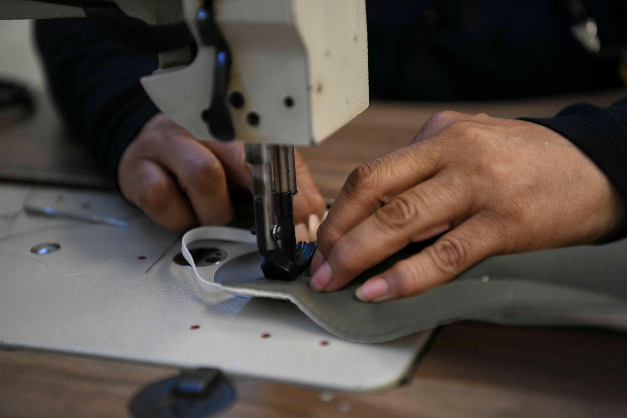 Wilma Zeballos, 89th Maintenance Group survival shop seamstress, sews a facemask at Joint Base Andrews, Md., Apr. 16, 2020. The survival shop recently sewed over 700 masks to support mission essential personnel.  (U.S. Air Force photo by Airman 1st Class Spencer Slocum)