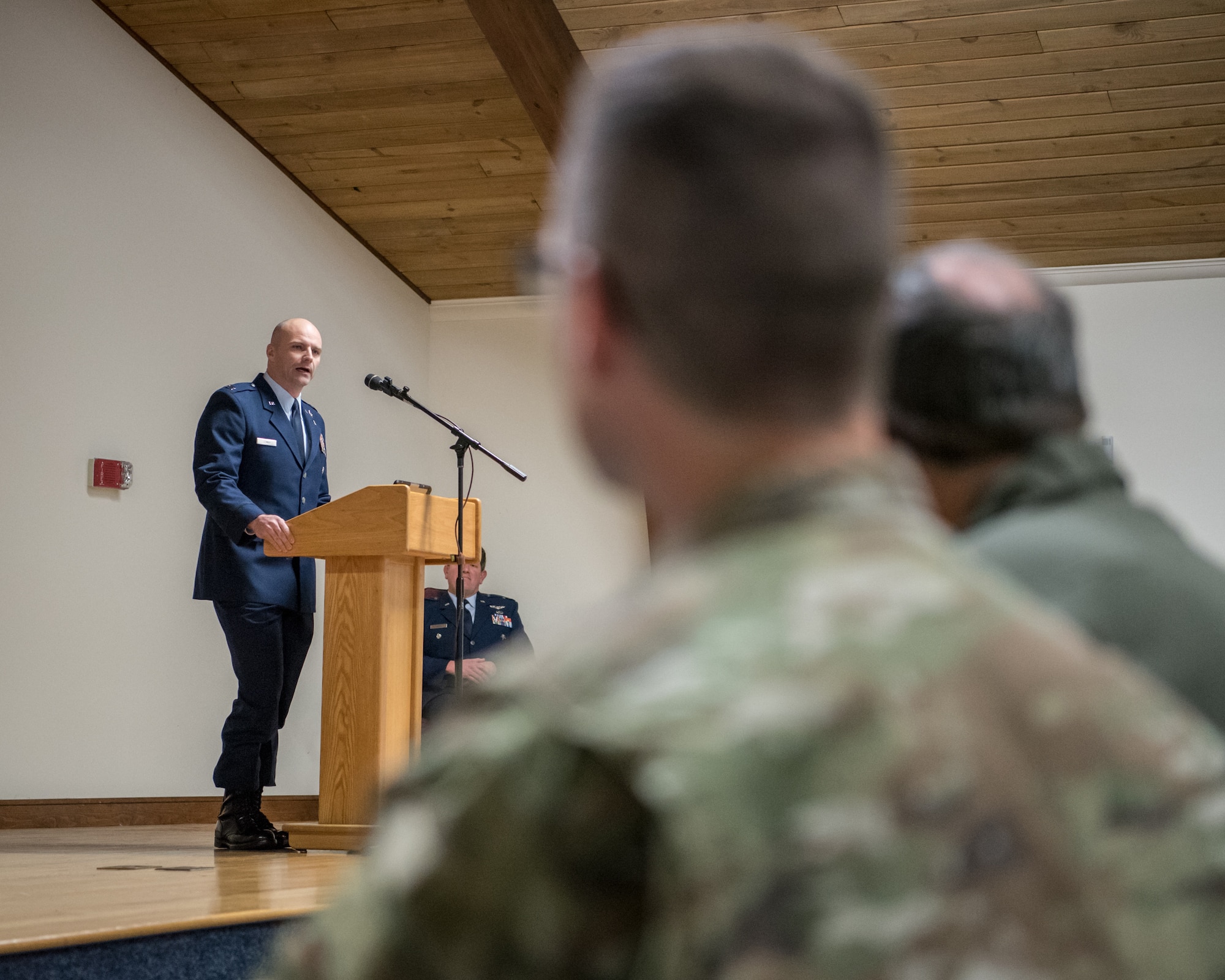 Capt. Russ LeMay, Norse Troop officer in charge for the 123rd Special Tactics Squadron, speaks at the retirement ceremony of Chief Master Sgt. Aaron May, the outgoing chief enlisted manager for the 123rd Special Tactics Squadron, at the Kentucky Air National Guard Base in Louisville, Ky., on Dec. 7, 2019. May is retiring after more than 26 years of service to the Kentucky Air National Guard and U.S. Air Force. (U.S. Air National Guard photo by Staff Sgt. Joshua Horton)