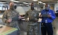 Lt. Col. Richard Hulun (left), 89th Maintenance Group (MXG) deputy commander, 1st Lt. Trey Riley, 89th MXG executive officer and James Wilson, 89th MXG survival shop lead, show three facemasks the 89th MXG has made at Joint Base Andrews, Md., Apr. 16, 2020. The shop has supplied personnel with over 700 masks. (U.S. Air Force photo by Airman 1st Class Spencer Slocum)