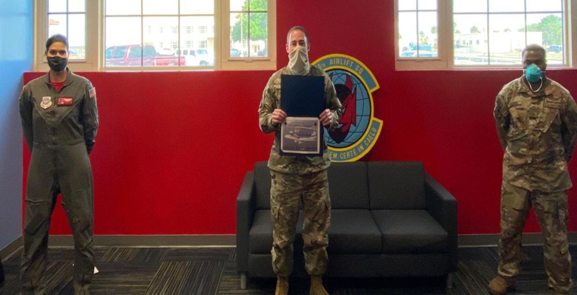 Lt. Col. Menola Guthrie, left, 50th Air Refueling Squadron commander and Master Sgt. Michael Fulton, right, 50th ARS acting first sergeant, present Tech. Sgt. Joshua Baca, 50th ARS squadron aviation resource manager, with the MacDill First Sergeants Council's Diamond Sharp Award for the month of March, 2020. Baca led the operation group’s control center, ensuring successful command and control operations for assigned personnel supporting the wing’s operational missions. The Diamond Sharp Award is a monthly award that recognizes an Airman and a non-commissioned officer nominated by their supervisors who excel in the performance of their primary duties, leadership and professionalism. (U.S. Air Force photo)
