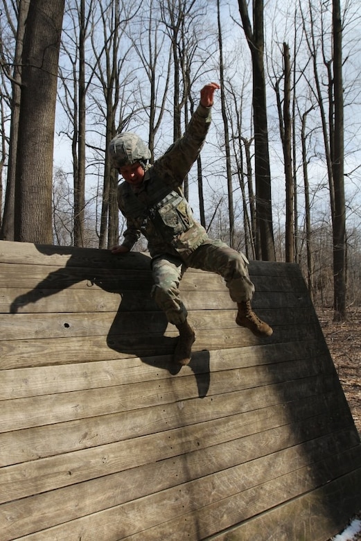 GLEN ARM, Md. -- Spc. Eva Perry, a cryptologic linguist (35P), from Issaquah, Washington, and assigned to B Company, 782nd Military Intelligence (MI) Battalion (Cyber), competes against her peers in an obstacle course event during the 780th MI Brigade’s Best Warrior Competition on March 6.