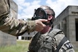 FORT BRAGG, N.C. - Staff Sgt. David Rosa, a psychological operations specialist representing the U.S. Army Civil Affairs and Psychological Operations Command, gets his gas mask checks by a drill sergeant while competing in the combat skills testing event at the 2017 U.S. Army Reserve Best Warrior Competition at Fort Bragg, N.C. June 14. This year’s Best Warrior Competition will determine the top noncommissioned officer and junior enlisted Soldier who will represent the U.S. Army Reserve in the Department of the Army Best Warrior Competition later this year at Fort A.P. Hill, Va. (U.S. Army Reserve photo by Sgt. Jennifer Shick)