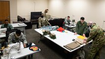 Airmen from the 2nd Operations Support Squadron make masks for Barksdale personnel at Barksdale Air Force Base, La., April 16, 2020. Mask making material was donated by Barksdale residents and community partners. (U.S. Air Force photo by Airman 1st Class Jacob B. Wrightsman)