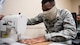 Airman 1st Class David S. Kyambadde, 2nd Operations Support Squadron aircrew flight equipment maintainer, operates a sewing machine to sew face masks at Barksdale Air Force Base, La., April 16, 2020. All Airmen of the 2nd OSS AFE shop learned to sew as part of their technical training to repair aircrew equipment including parachutes, flight suits and other various equipment. (U.S. Air Force photo by Airman 1st Class Jacob B. Wrightsman)