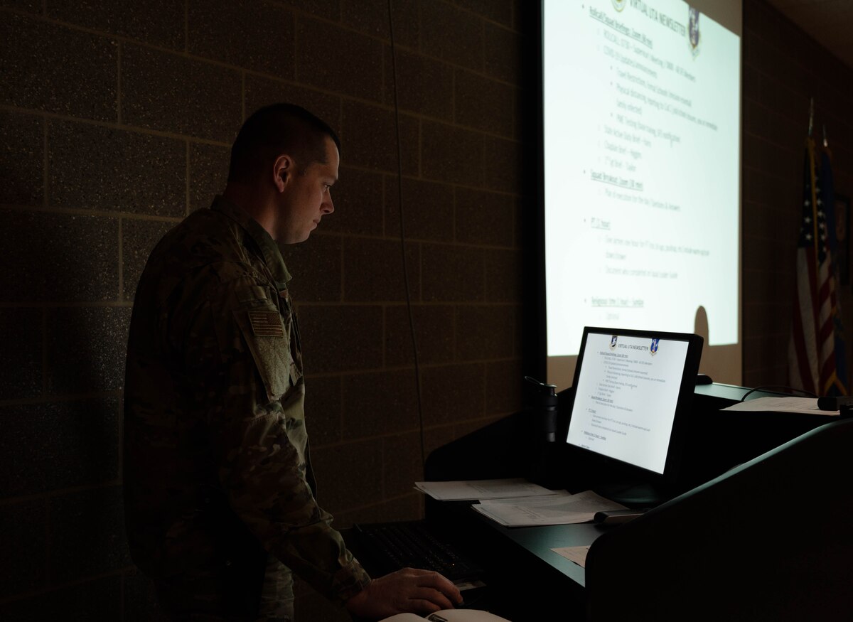 Tech. Sgt. Jared Mengenhausen, 114th Security Forces training manager, looks over the training material for the Security Forces Squadron's first virtual unit training assembly.