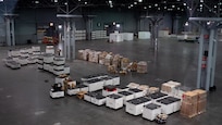 Soldiers move supplies at the Jacob K. Javits Convention Center in New York City, Mar. 28.
