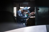 U.S. Army Spc. Daniel Fields, assigned to the 9th Hospital Center, takes a patient’s vitals inside of an ambulance at the Javits New York Medical Station (JNYMS).