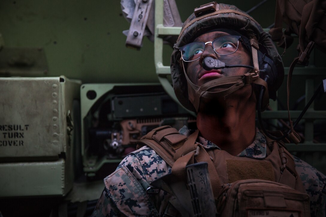 U.S. Marine Corps Cpl. Mark Trevino, a transmissions systems operator with 2nd Battalion, 4th Marine Regiment, 1st Marine Division conducts a mechanized raid at Marine Corps Base Camp Pendleton, California on Jan. 29, 2020. 2nd Battalion, 4th Marine Regiment worked with 3d Assault Amphibian Battalion to conduct a mechanized raid to enhance lethality and hone combat skills. (U.S. Marine Corps photo by Sgt. Teagan Fredericks)