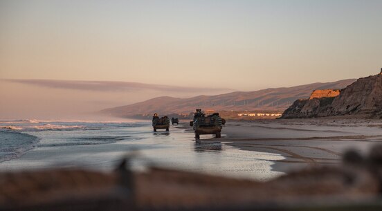 U.S. Marine Corps Assault Amphibious Vehicles with 3d Assault Amphibian Battalion, 1st Marine Division drive on a beach at Marine Corps Base Camp Pendleton, California on Jan. 29, 2020. 2nd Battalion, 4th Marine Regiment worked with 3d Assault Amphibian Battalion to conduct a mechanized raid to enhance lethality and hone combat skills. (U.S. Marine Corps photo by Sgt. Teagan Fredericks)