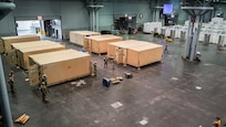 Soldiers from 531st Hospital Center set up mobile work stations in the Javits New York Medical Station (JNYMS).  The stations will be used to conduct laboratory, x-ray and pharmacy operations.