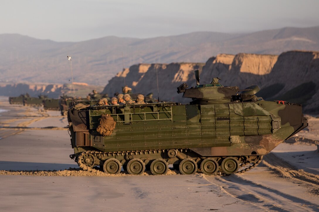 U.S. Marine Corps assault amphibious vehicles with 3d Assault Amphibian Battalion, 1st Marine Division drive on a beach at Marine Corps Base Camp Pendleton, California on Jan. 29, 2020. 2nd Battalion, 4th Marine Regiment worked with 3d Assault Amphibian Battalion to conduct a mechanized raid to enhance lethality and hone combat skills. (U.S. Marine Corps photo by Sgt. Teagan Fredericks)