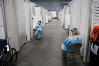 Soldiers assigned to the Javits New York Medical Station (JNYMS) monitor COVID-19 patients in the facility’s intensive care unit.