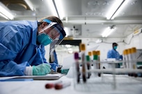 Army Staff Sgt. Kierstin Pontious, assigned to the 9th Hospital Center, processes blood samples from patients recovering from COVID-19 in a mobile laboratory at the Javits New York Medical Station, Apr. 8, 2020.