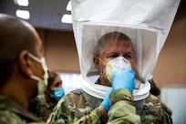 Joint Task Force New York/New Jersey Commanding General Maj. Gen. William “Bill” Hall gets fit tested for a N95 mask by a Soldier stationed at Field Medical Station Edison, located in the New Jersey Convention and Exposition Center, April 15, 2020.