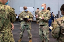 U.S. Air Force Command Chief Master Sgt. James Brown, Task Force New York/New Jersey command senior enlisted leader, holds a senior enlisted huddle to discuss commander priorities and topics that are effecting service members at the Javits New York Medical Station, April 18, 2020.