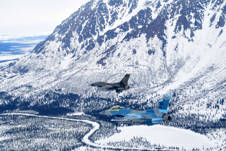 Two U.S. Air Force F-16 Fighting Falcons assigned to the 18th Aggressor Squadron fly over the Joint Pacific Alaska Range Complex, April 17, 2020.