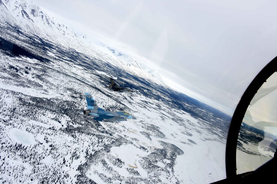 Two U.S. Air Force F-16 Fighting Falcons assigned to the 18th Aggressor Squadron fly over the Joint Pacific Alaska Range Complex (JPARC) April 17, 2020.