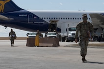 An Airmen walks away from plane