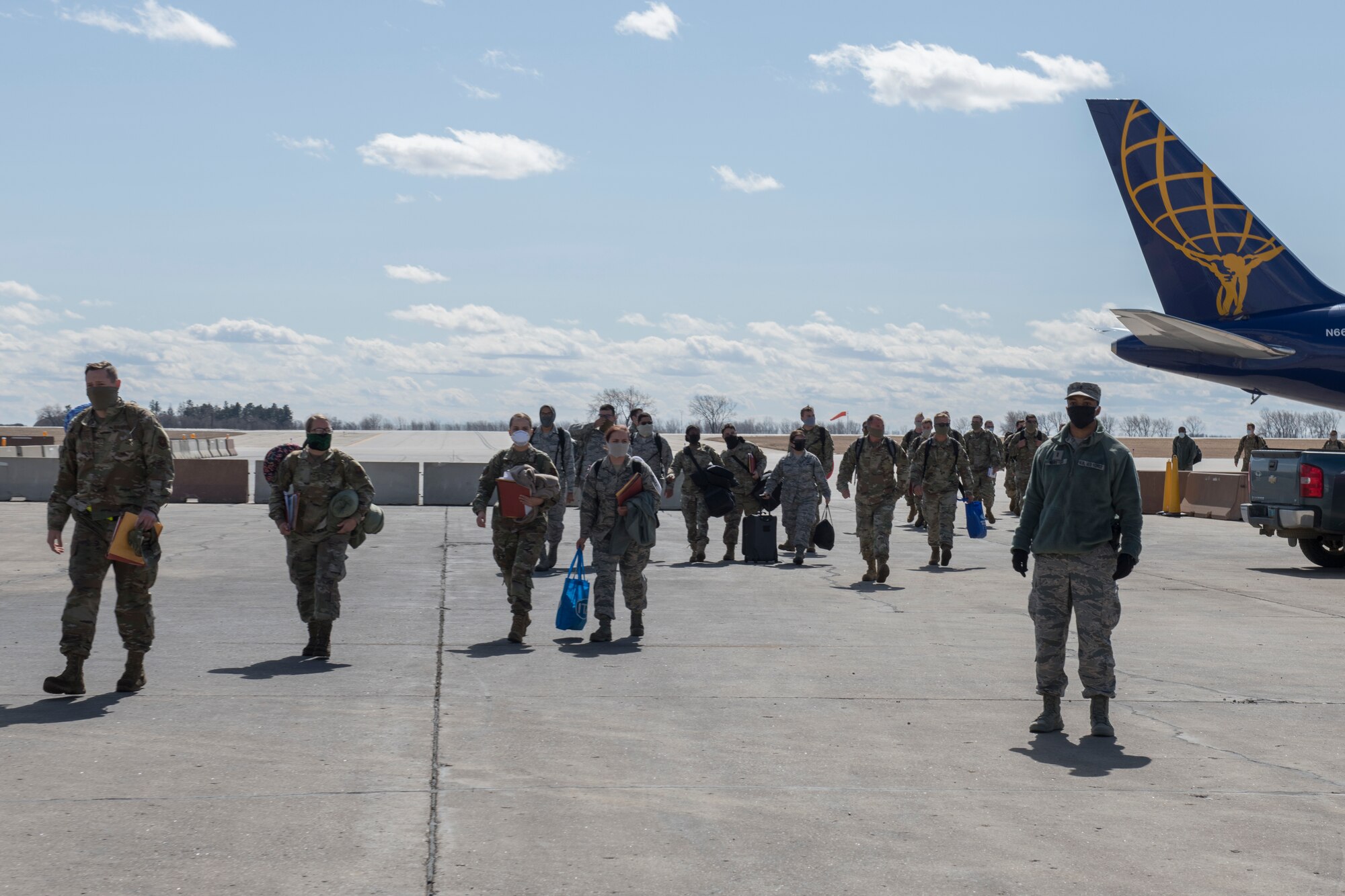 Airmen walking away from Airplane