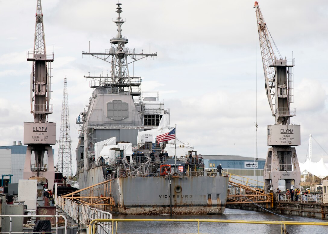 A ship enters dry dock.