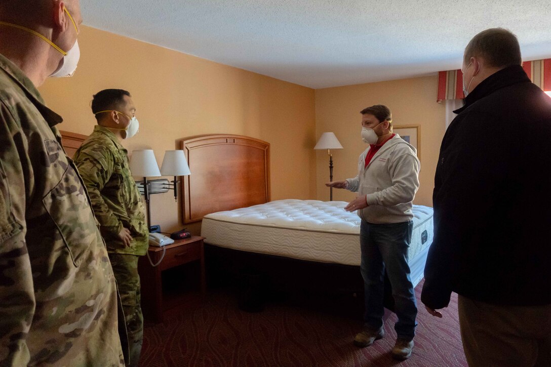 U.S. Army Maj. Gen. Mark Toy, Mississippi Valley Division commander, and Brig. Gen. Levon Cumpton, Missouri National Guard adjutant general, tour the alternate care site in St. Louis, Missouri, April 13, 2020. The site was developed to support health care facilities in the area. (U.S. Air National Guard photo by Senior Airman Audrey Chappell)