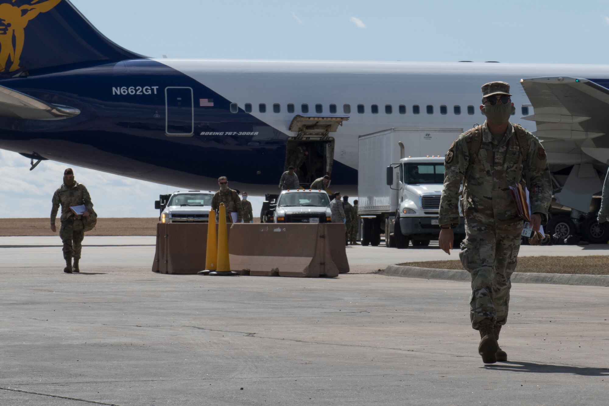 An Airmen walks away from plane