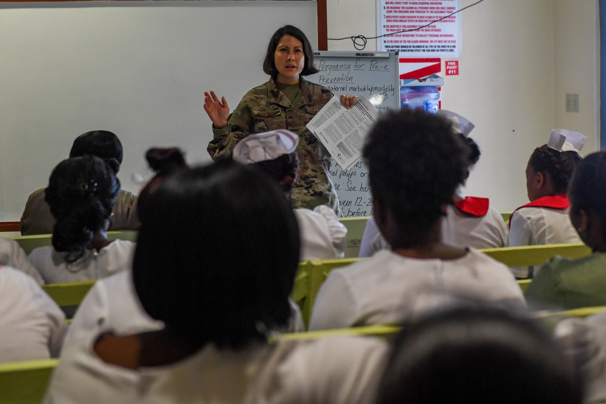 U.S. Air Force Maj. Melissa Legowski, nurse practitioner from the 99th Medical Group at Nellis Air Force Base, briefs Guyanese nurses during a lecture at the Linden Mackenzie Hospital during New Horizons exercise 2019 in Linden, Guyana, June 13, 2019.  The New Horizons exercise 2019 provides U.S. military members an opportunity to train for an overseas deployment and the logistical requirements it entails. The exercise promotes bilateral cooperation by providing opportunities for U.S. and partner nation military engineers, medical personnel and support staff to work and train side by side. (U.S. Air Force photo by Senior Airman Derek Seifert)