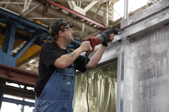 Shop 11 Work Leader John Mcclelland performs work inside the shop.