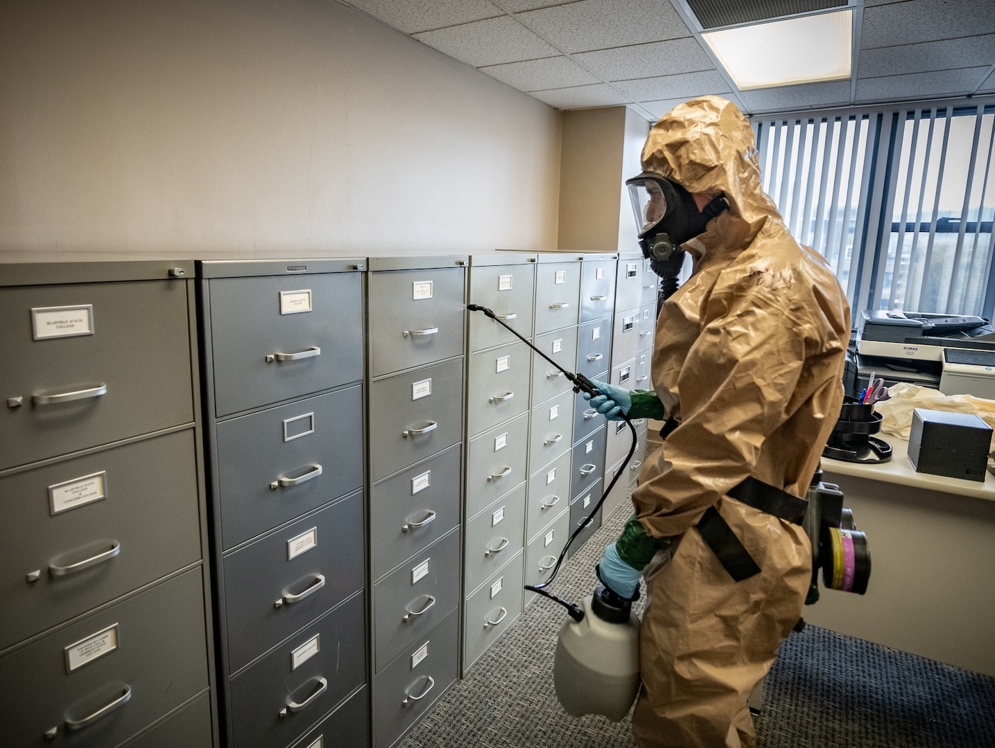 Members of the West Virginia National Guard’s Task Force Chemical, Biological, Radiological and Nuclear Response Enterprise sanitize workspaces for the West Virginia Higher Education Policy Commission in Charleston, West Virginia, April 11, 2020.