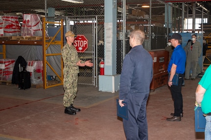 NNSY Shipyard Commander Capt. Kai Torkelson addresses the Off-Yard Carriers Team on their efforts in bringing the USS Gerald R. Ford (CVN 78) to certified status and readniess for naval aviation training.