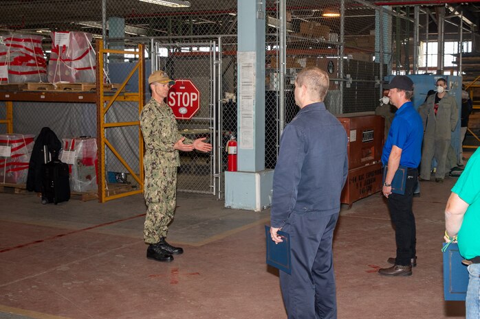 NNSY Shipyard Commander Capt. Kai Torkelson addresses the Off-Yard Carriers Team on their efforts in bringing the USS Gerald R. Ford (CVN 78) to certified status and readniess for naval aviation training.