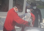 The Coast Guard Cutter Kathleen Moore crew offloads approximately 1,300 pounds of marijuana, worth an estimated $1.1 million dollars, April 13, 2020, at Coast Guard Base Miami Beach.