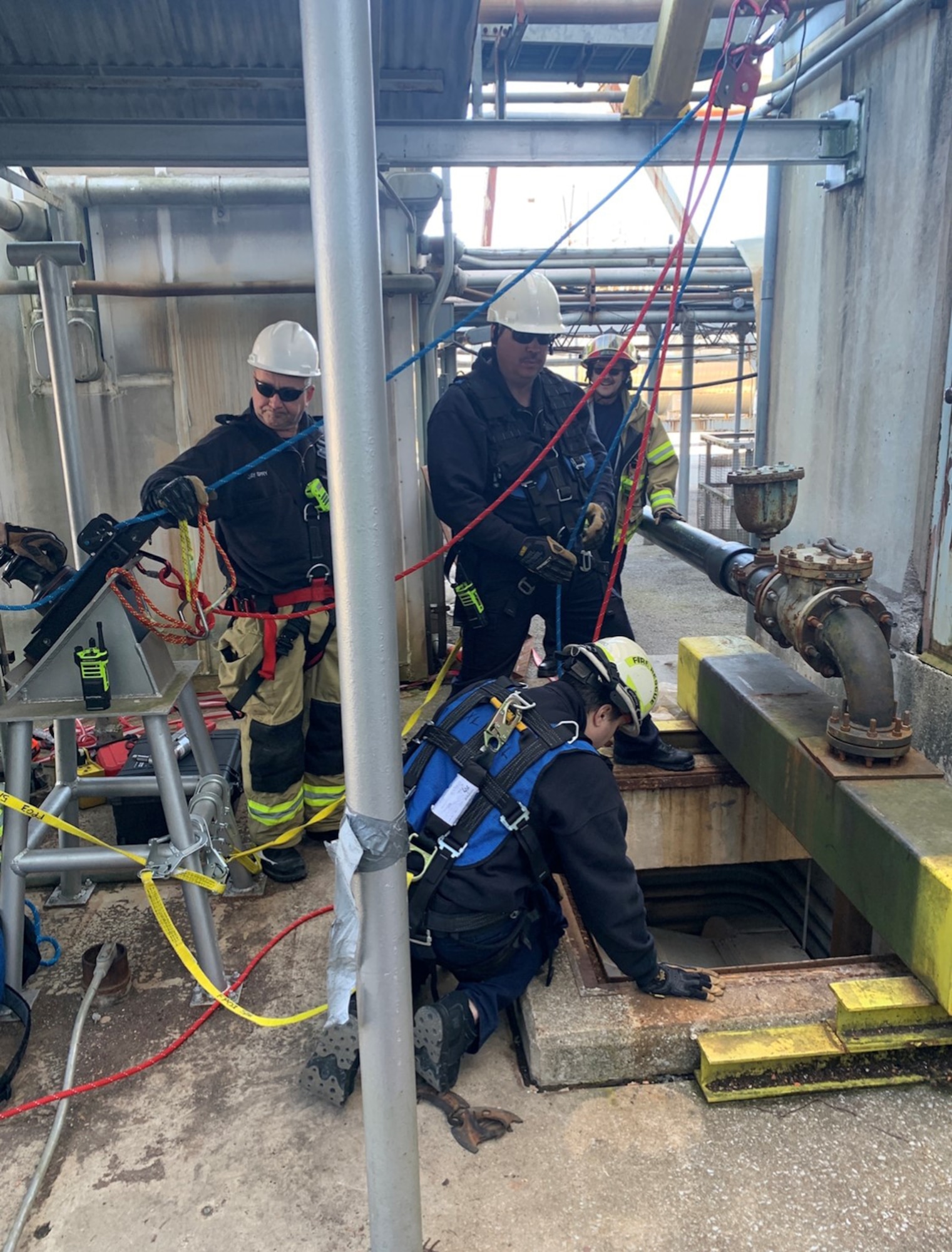 On. Feb. 29, Arnold Fire and Emergency Service personnel use a rigging system to retrieve five Arnold Engineering Development Complex craftsmen from the bottom of the J-4 Rocket Motor Test Facility after the elevator control system failed to respond at Arnold Air Force Base. (U.S. Air Force photo)