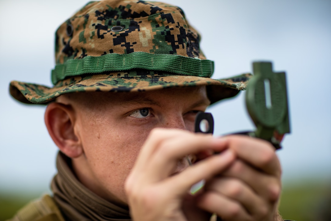 A U.S. Marine shoots an azimuth with a lensatic compass during a brigade platoon field exercise on Marine Corps Base Camp Pendleton, California, April 7.