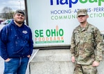 Devin Berry, left, and Ohio National Guard Pfc. Jayden Rutter, both lifelong Southeast Ohio residents, outside the Southeast Ohio Foodbank in Logan April 10, 2020. Berry, a laborer at the food bank for five years, has been working with Rutter and other Soldiers of the 237th Support Battalion to package and distribute food during the COVID-19 pandemic.