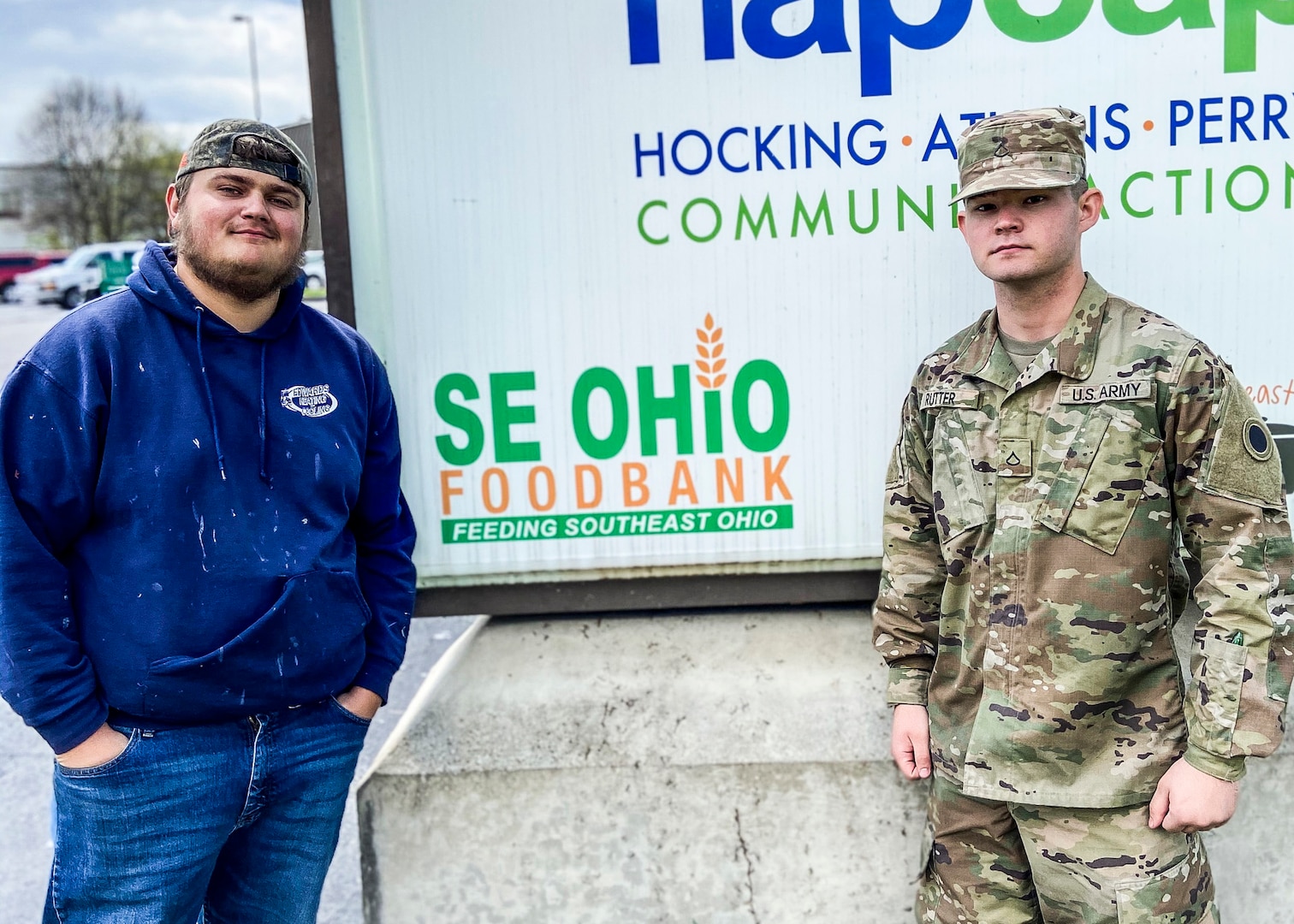 Devin Berry, left, and Ohio National Guard Pfc. Jayden Rutter, both lifelong Southeast Ohio residents, outside the Southeast Ohio Foodbank in Logan April 10, 2020. Berry, a laborer at the food bank for five years, has been working with Rutter and other Soldiers of the 237th Support Battalion to package and distribute food during the COVID-19 pandemic.