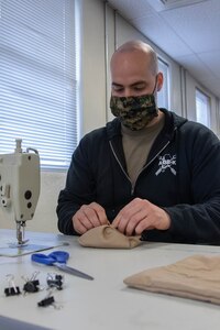 To slow the spread of COVID-19 among Soldiers and Airmen in the Utah National Guard, parachute riggers with 19th Special Forces Group (Airborne), at Camp Williams, use their skills to make approximately 2,000 face masks.