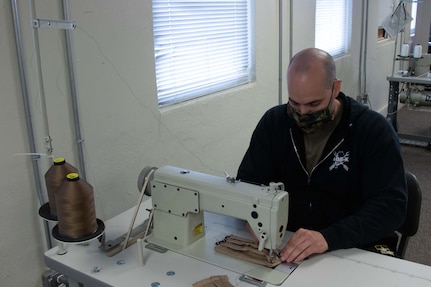 To slow the spread of COVID-19 among Soldiers and Airmen in the Utah National Guard, parachute riggers with 19th Special Forces Group (Airborne), at Camp Williams, use their skills to make approximately 2,000 face masks.