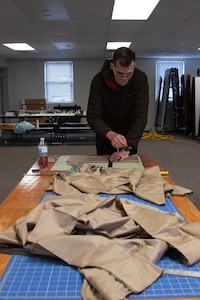 To slow the spread of COVID-19 among Soldiers and Airmen in the Utah National Guard, parachute riggers with 19th Special Forces Group (Airborne), at Camp Williams, use their skills to make approximately 2,000 face masks.