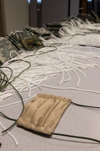 To slow the spread of COVID-19 among Soldiers and Airmen in the Utah National Guard, parachute riggers with 19th Special Forces Group (Airborne), at Camp Williams, use their skills to make approximately 2,000 face masks.