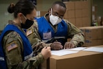 Oklahoma National Guard members from throughout the state check medical supply orders while assigned to the Strategic National Stockpile in Oklahoma City, April 20, 2020. Nearly 30 Guard members are helping fulfill, secure and transport critical supplies to facilities throughout the state.