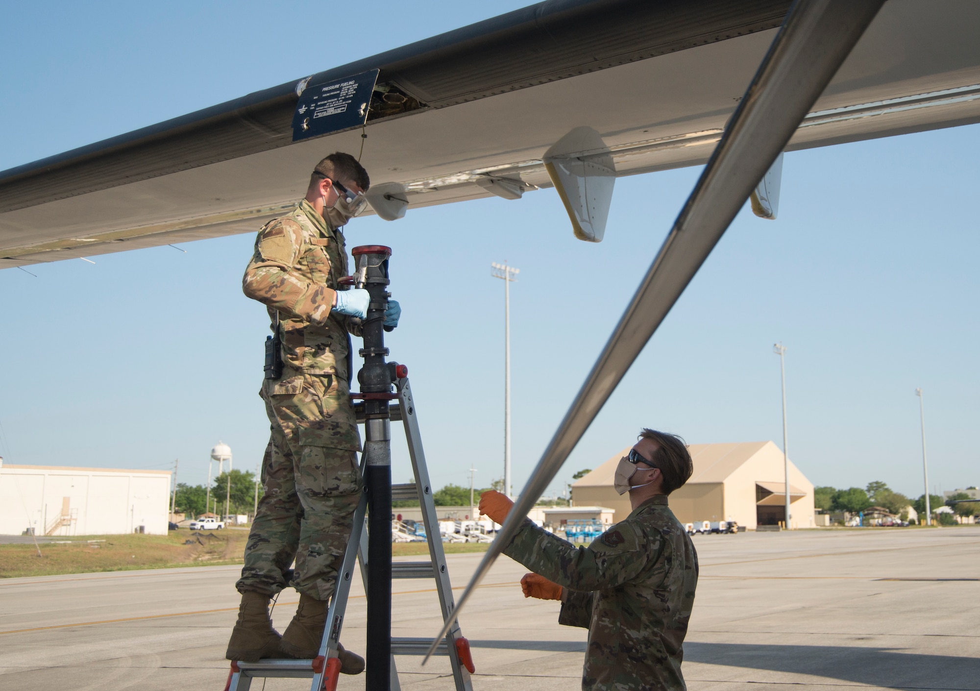 Crew chiefs refuel a C-146A Wolfhound