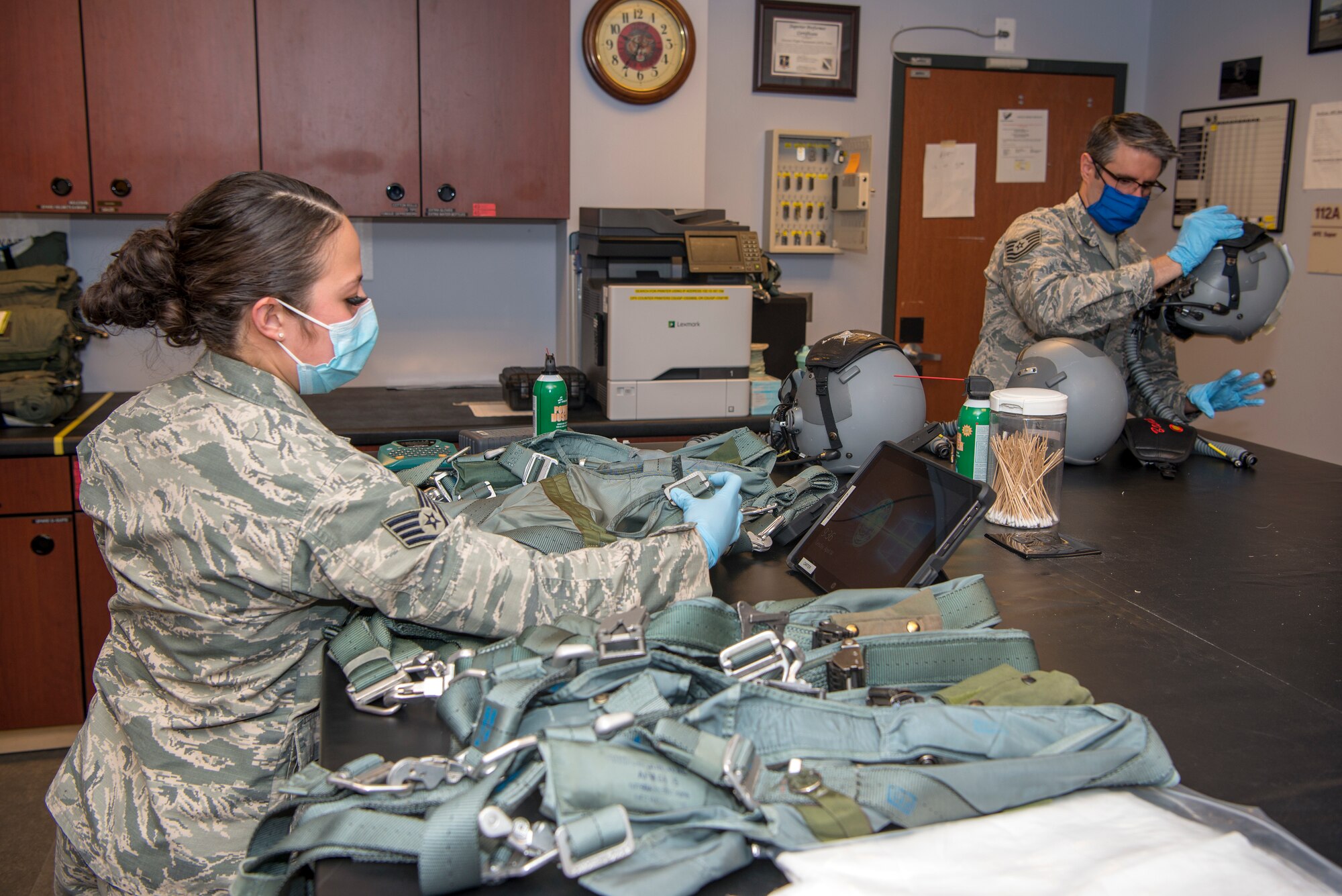 Airmen sewing masks