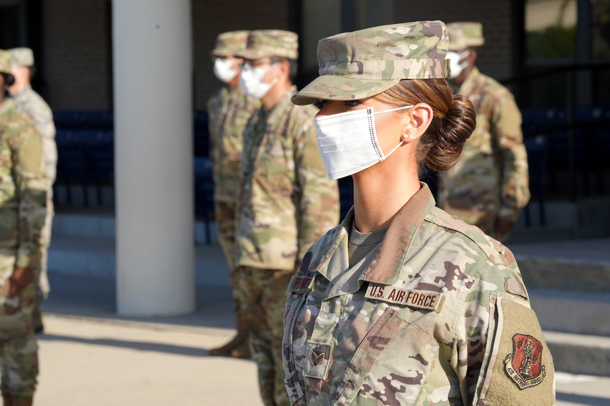 U.S. Air Force Senior Airman Katy Pennell, 335th Training Squadron student, participates in a Financial Management Course graduation at the Levitow Training Support Facility drill pad at Keesler Air Force Base, Mississippi, April 21, 2020. The class was the first to complete the updated Financial Management Course, which was recently introduced by the 335th TRS to improve the quality and efficiency of the class. (U.S. Air Force photo by Airman 1st Class Seth Haddix)