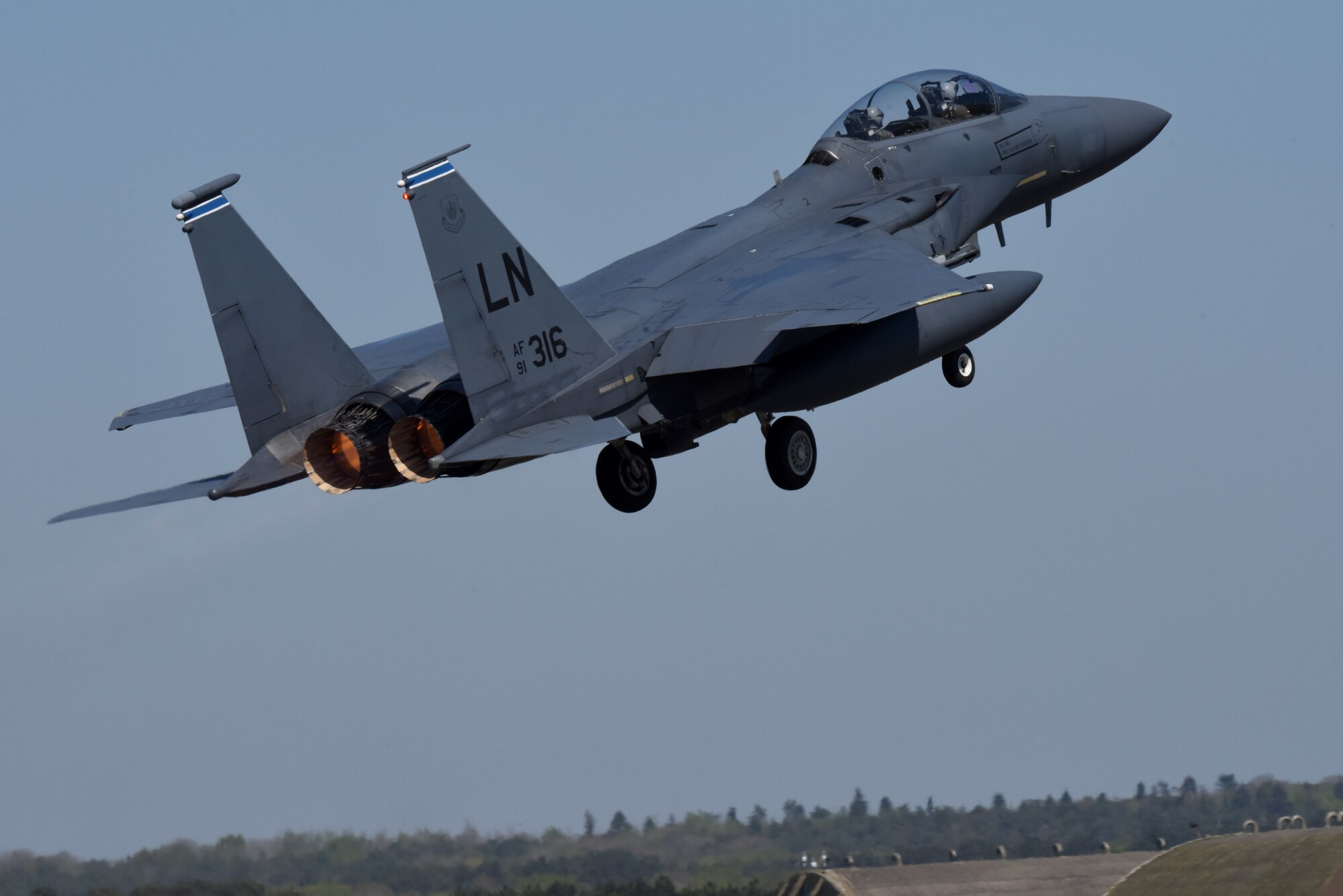 An F-15E Strike Eagle assigned to the 492nd Fighter Squadron takes off at Royal Air Force Lakenheath, England, April 21, 2020. The F-15E Strike Eagle navigation system uses a laser gyro and a Global Positioning System to continuously monitor the aircraft's position and provide information to the central computer and other systems, including a digital moving map in both cockpits. (U.S. Air Force photo by Airman 1st Class Rhonda Smith)